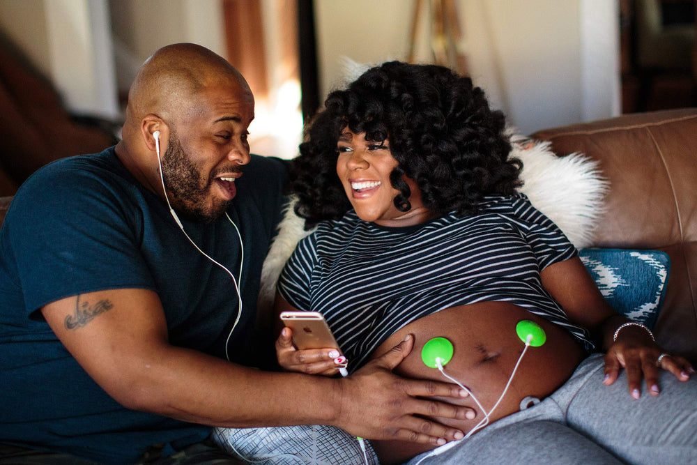 Wavhello BellyBuds mom and baby listening moment.