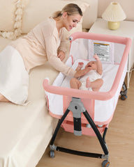 Wayfong bedside bassinet pink angle demonstrates close-to-bed design for easy nighttime feeds
