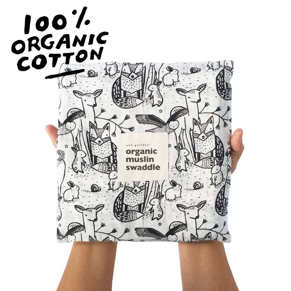 Wee Gallery forest animals swaddle folded layout for easy use and versatility.