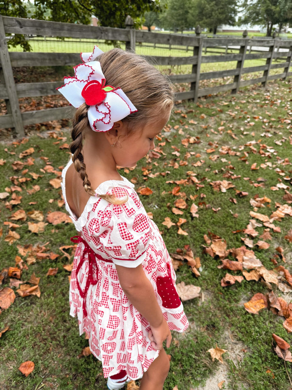 Wee Ones baby girl wearing Moonstitch bow enhances everyday outfits.