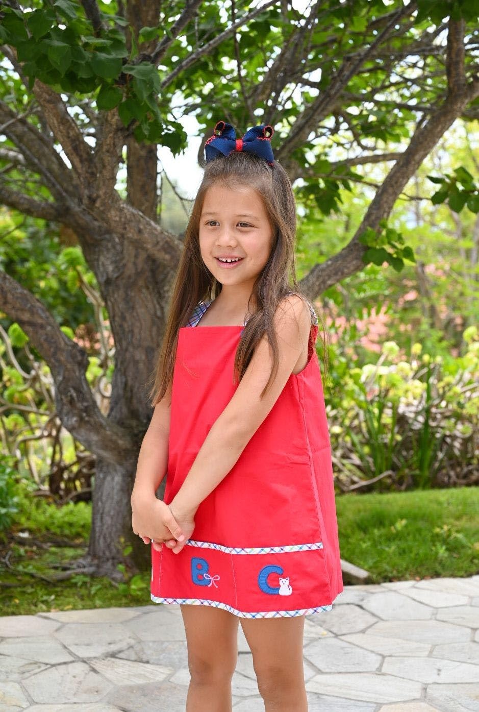 Wee Ones navy bow on clip with contrasting red trim for outfit coordination