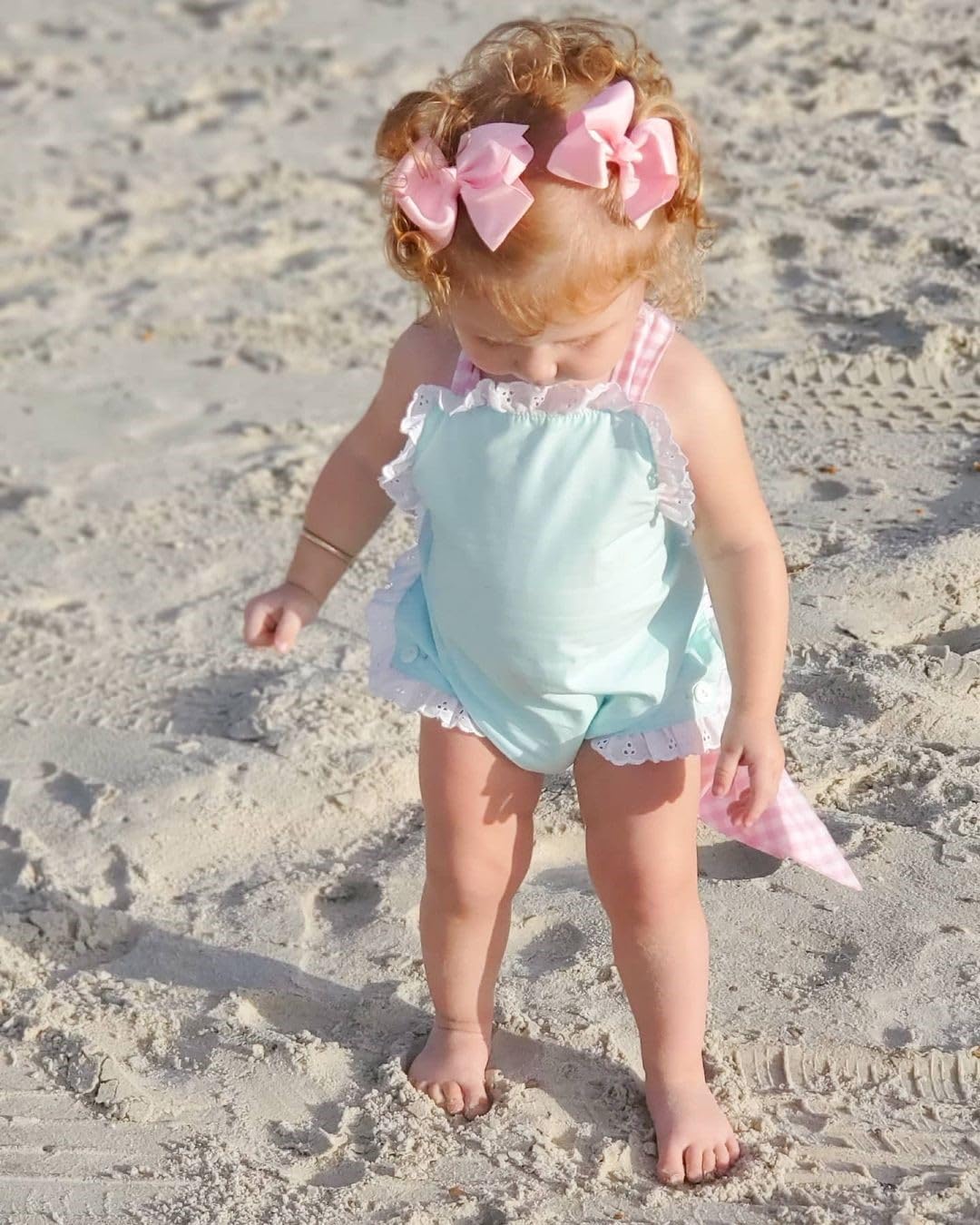 Wee Ones small ecru bow styled in hair for photos and dress-up