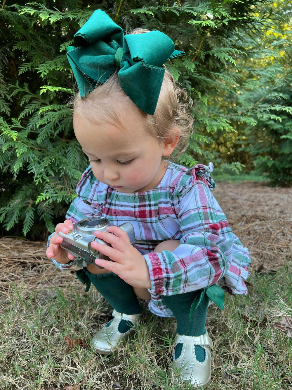 Wee Ones forest green bow with WeeStay clip keeps hair secure.