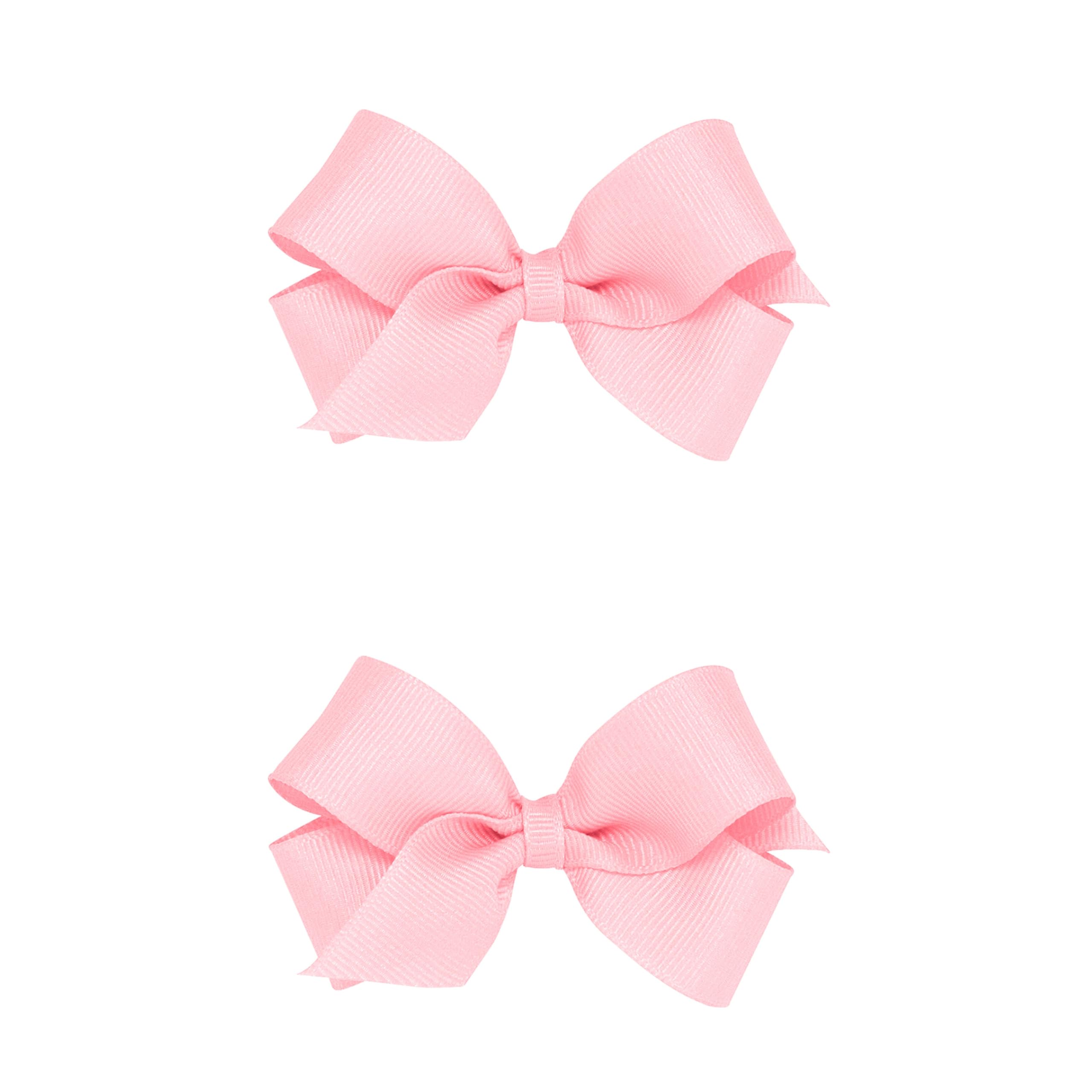 Wee Ones two-pack mini light pink grosgrain bows with a no-slip clip for secure wear.