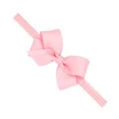Wee Ones classic grosgrain hair bow on matching baby band in light pink for versatile styling