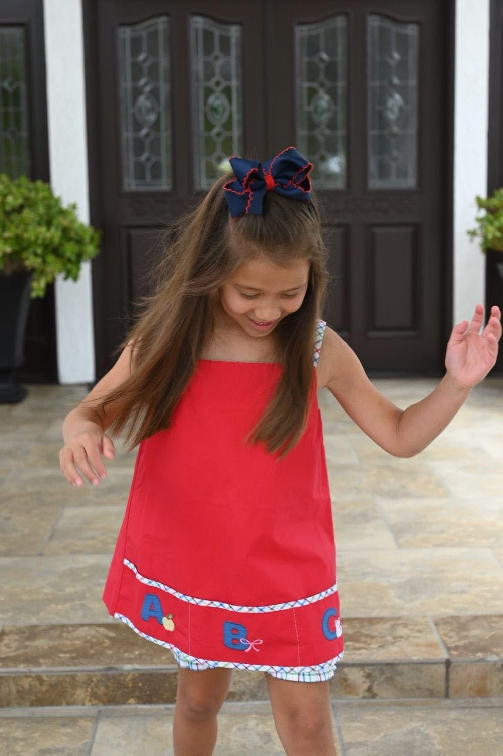 Wee Ones medium navy bow with red trim for versatile looks