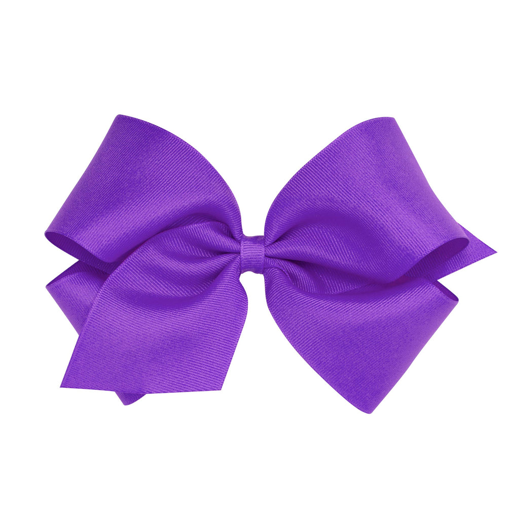 Wee Ones delphinium bow on WeeStay clip keeps hair tidy for busy mornings.