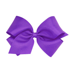 Wee Ones delphinium bow on WeeStay clip keeps hair tidy for busy mornings.