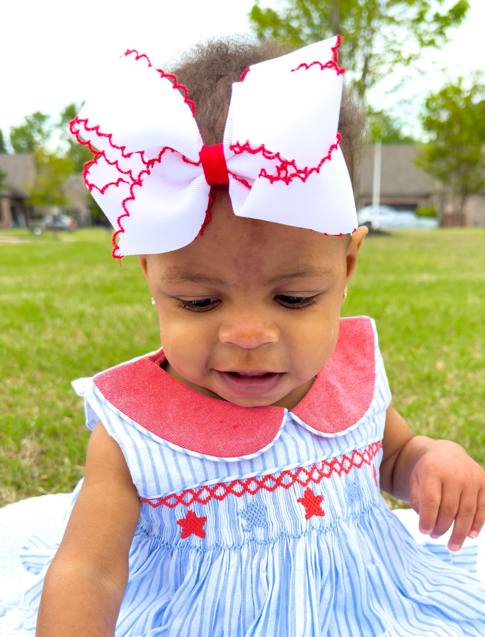 Wee Ones front view bow showcases soft pink accents for party looks.