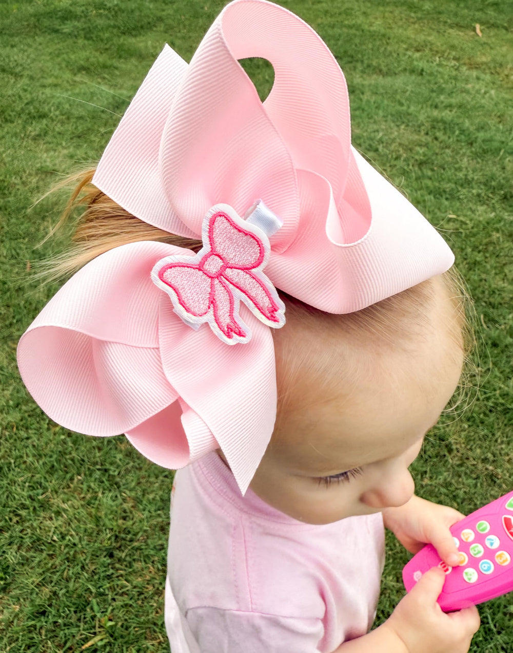 Gift-ready light pink Wee Ones bow for birthdays or special occasions.