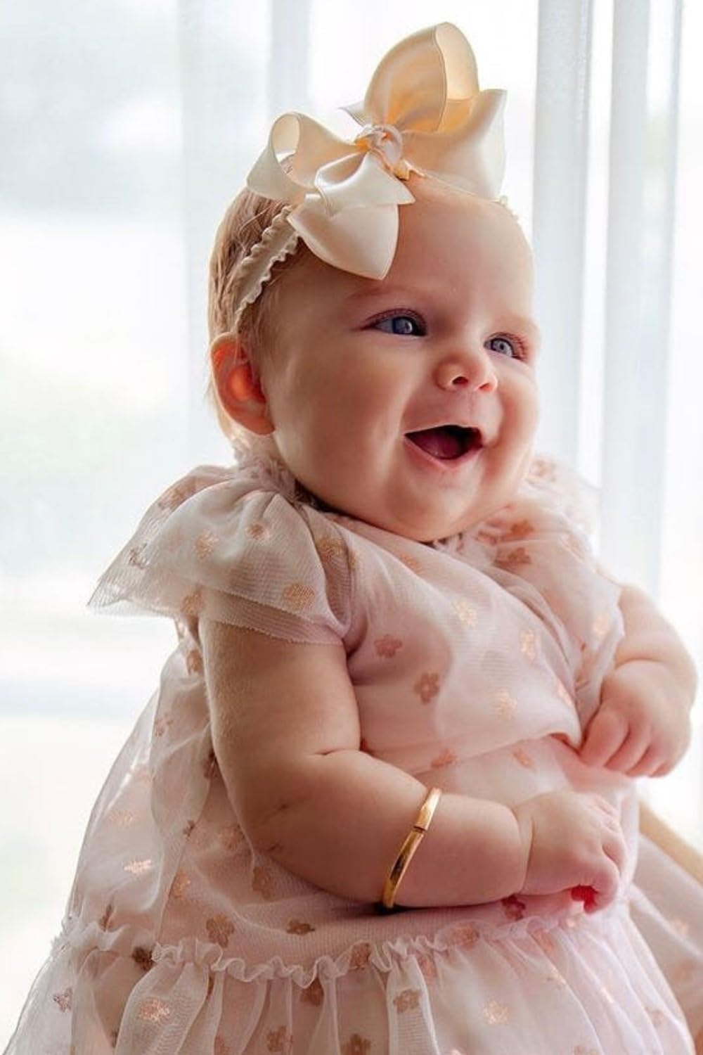 Wee Ones medium bow clip styled for dress up with knot wrap for special occasions.