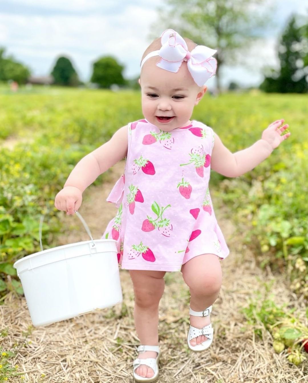 Wee Ones white pink bow on model offers a fun, age-appropriate accessory