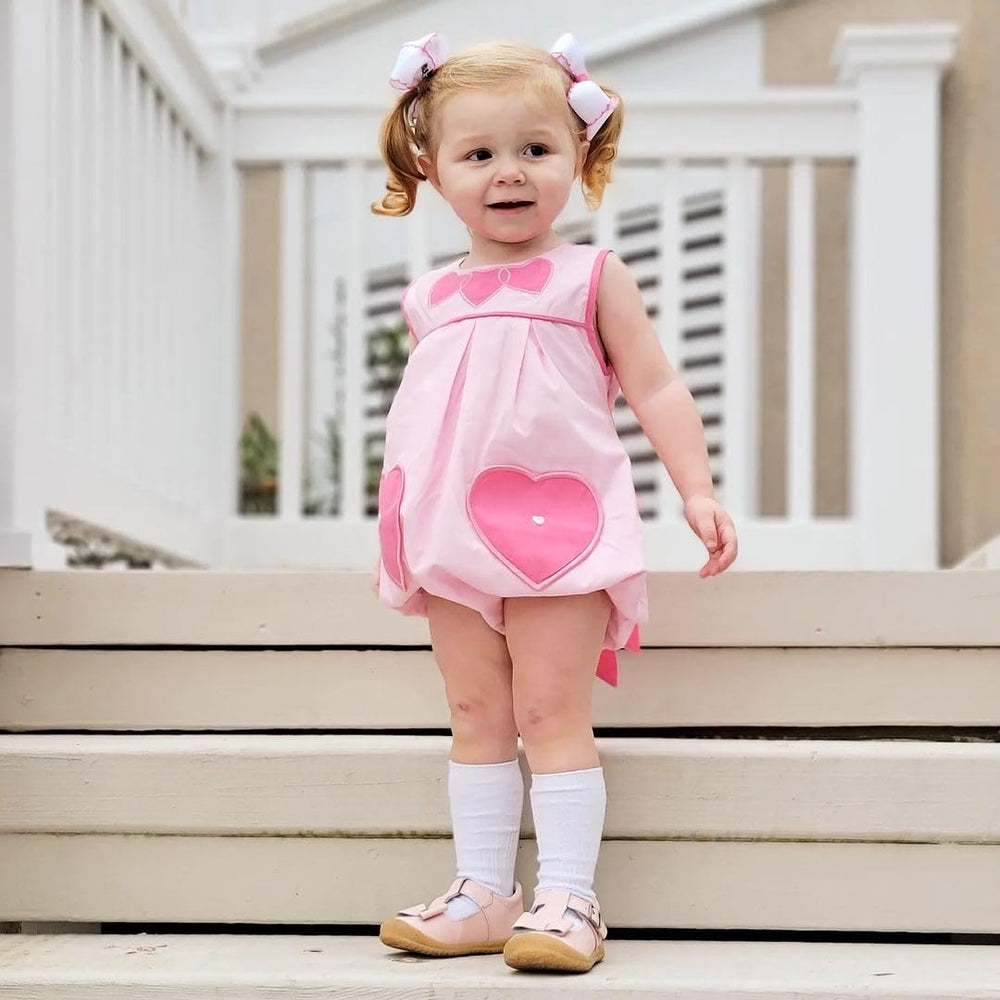 Wee Ones white bow with pink edge elevates everyday hair styling