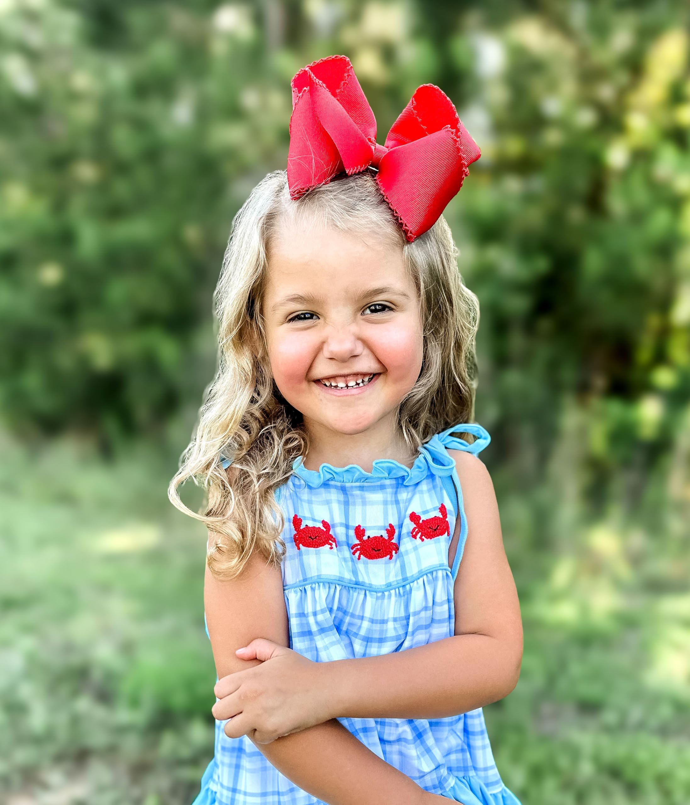 Wee Ones red fashion photoshoot shot showcases versatile styling with the bow.
