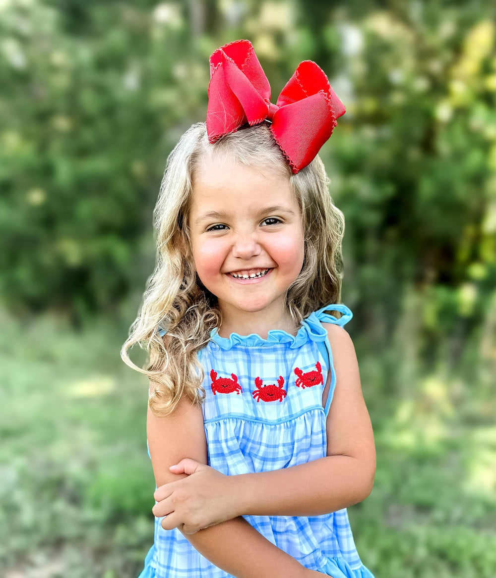 Wee Ones red fashion photoshoot shot showcases versatile styling with the bow.