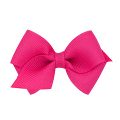 Wee Ones shocking pink bow on WeeStay clip keeps hair in place all day.