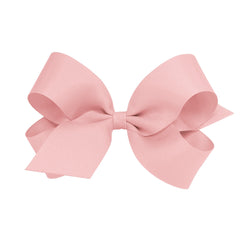Wee Ones Sweet Nectar bow on WeeStay clip keeps hair in place for everyday wear.