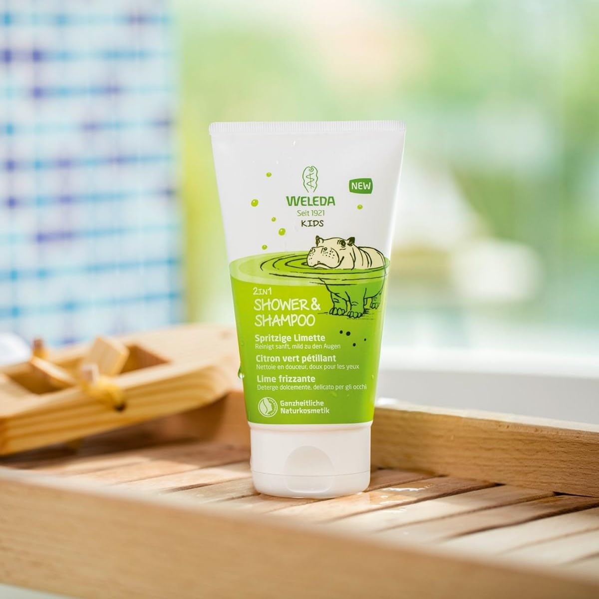 Weleda Kids 2-in-1 Lively Lime bath time scene with child enjoying bath