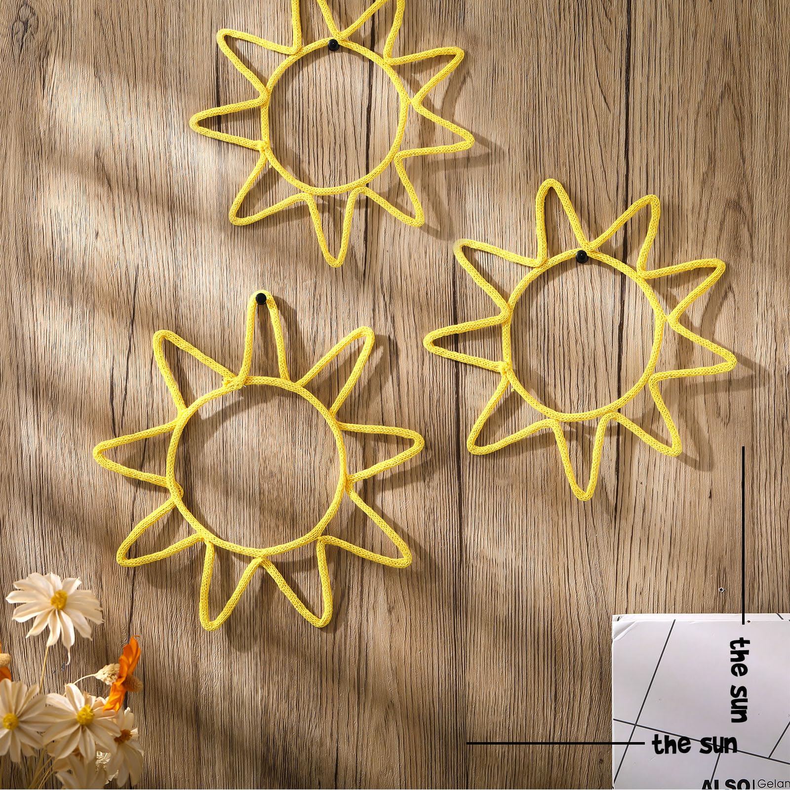 Wesiti gold knitted sun wall art creates a playful boho vibe in a kid's room.