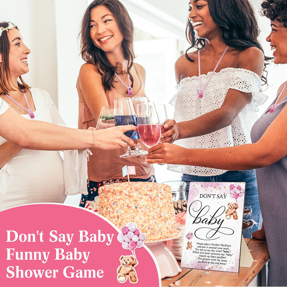 Wesiti gender reveal party setup with sign and favors on display.