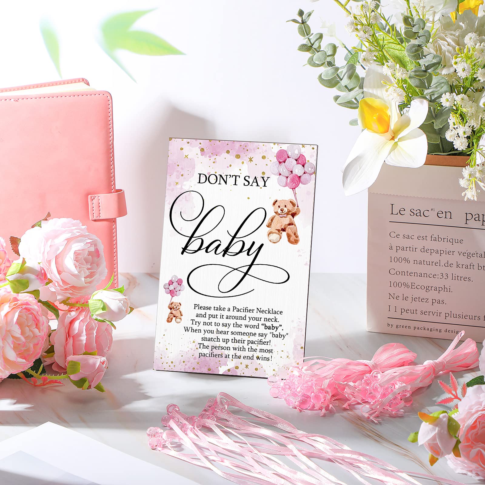 Wesiti pink baby shower table decor creates festive ambiance.