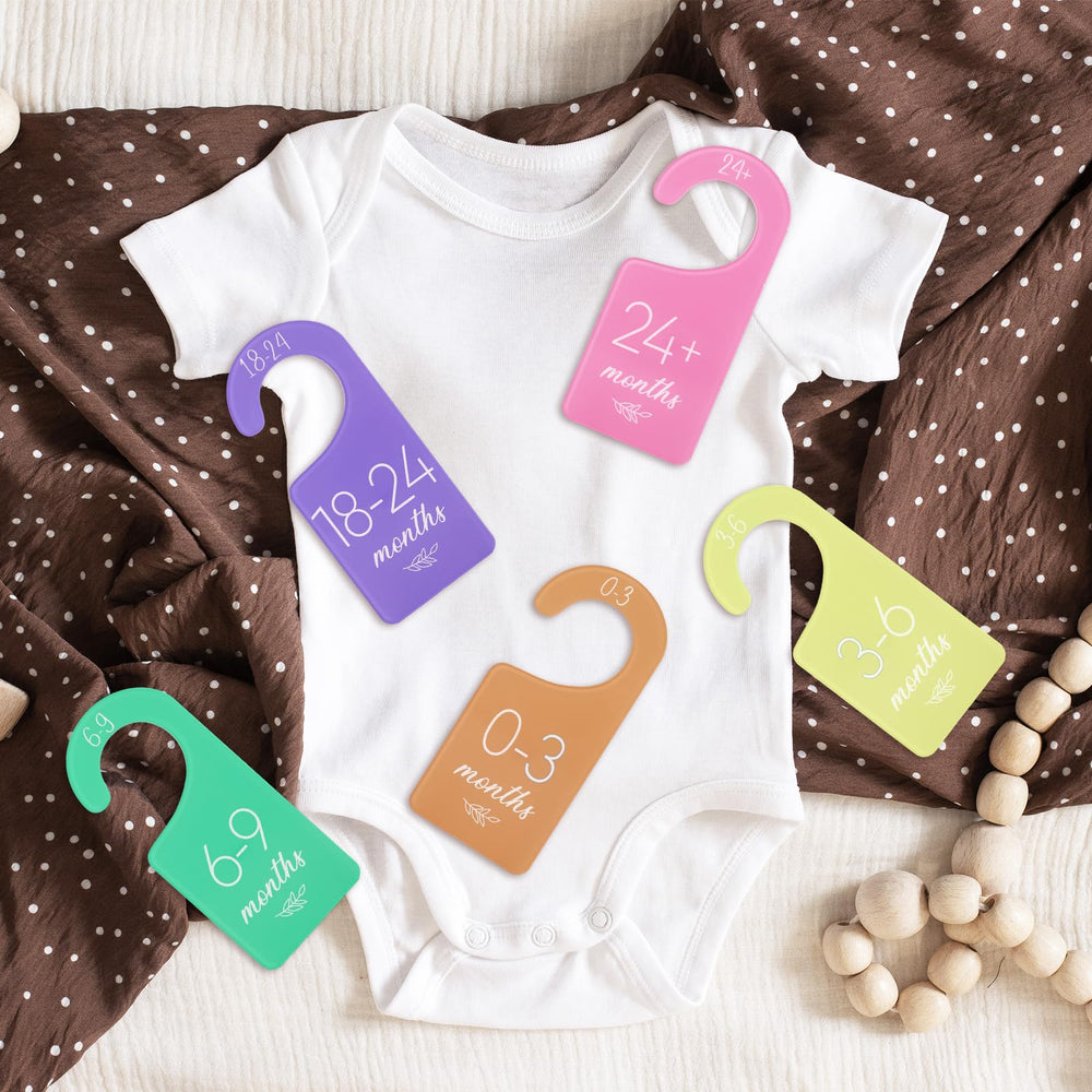 Whaline divider doubles as a keepsake from baby's growth.