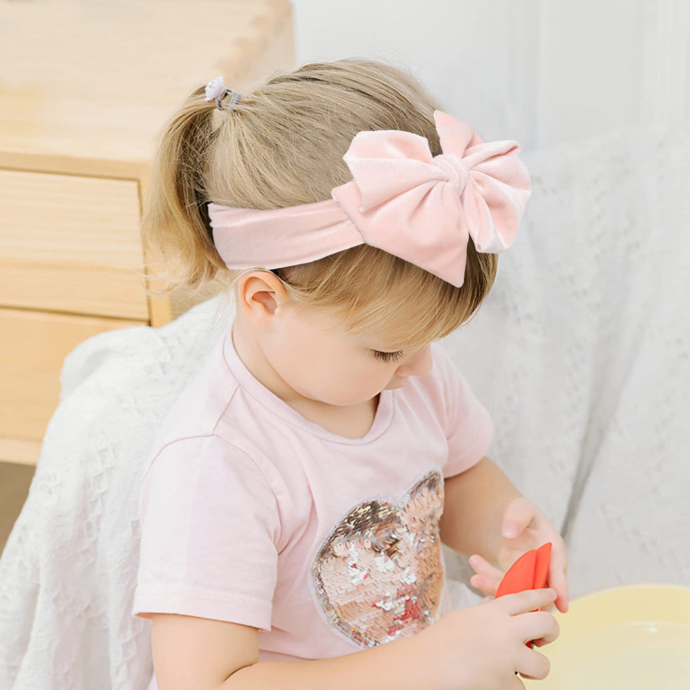 Whaline stretchable velvet headband offering secure, slip-free wear for active babies.