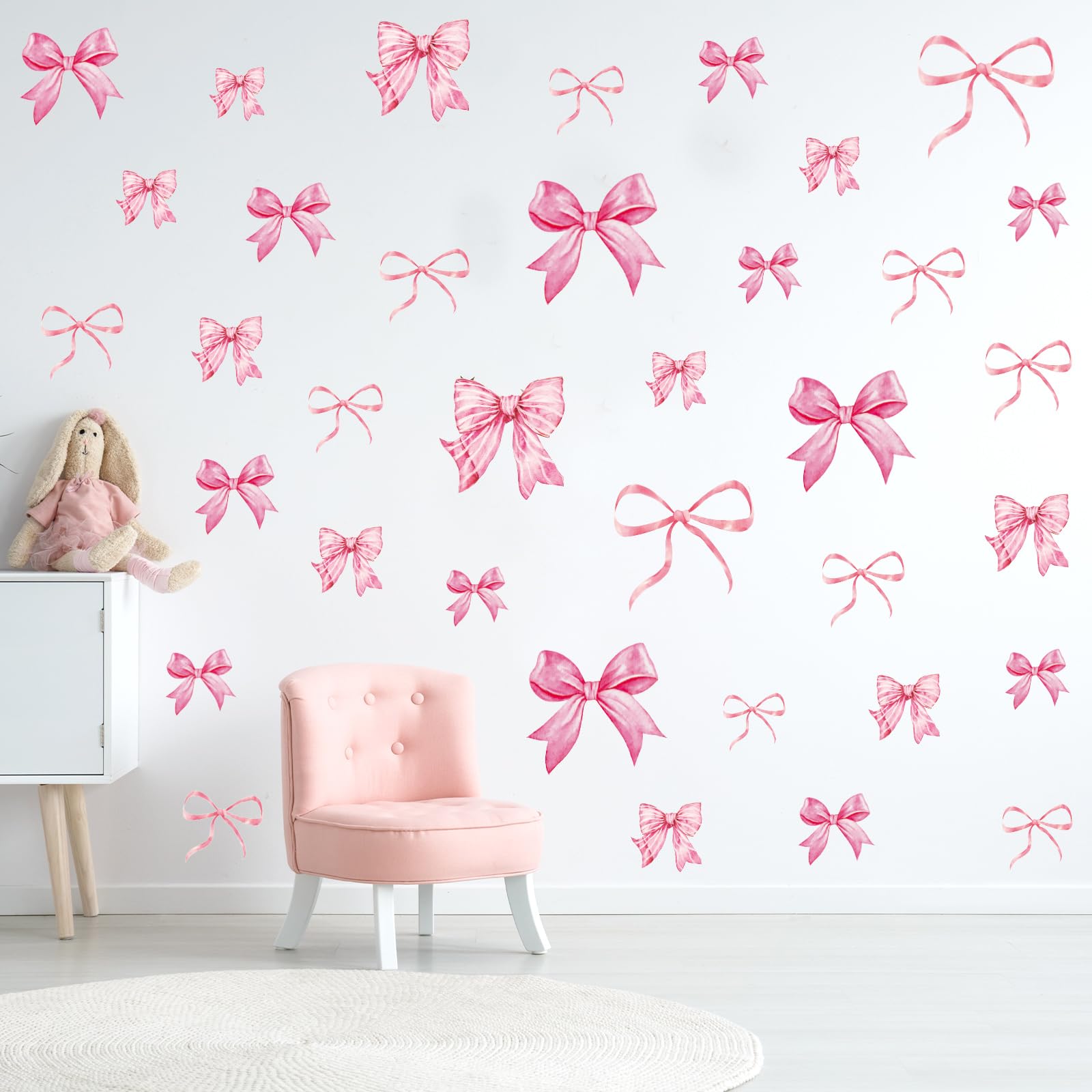 Whaline bow knot wall decals create a cozy nursery ambiance.