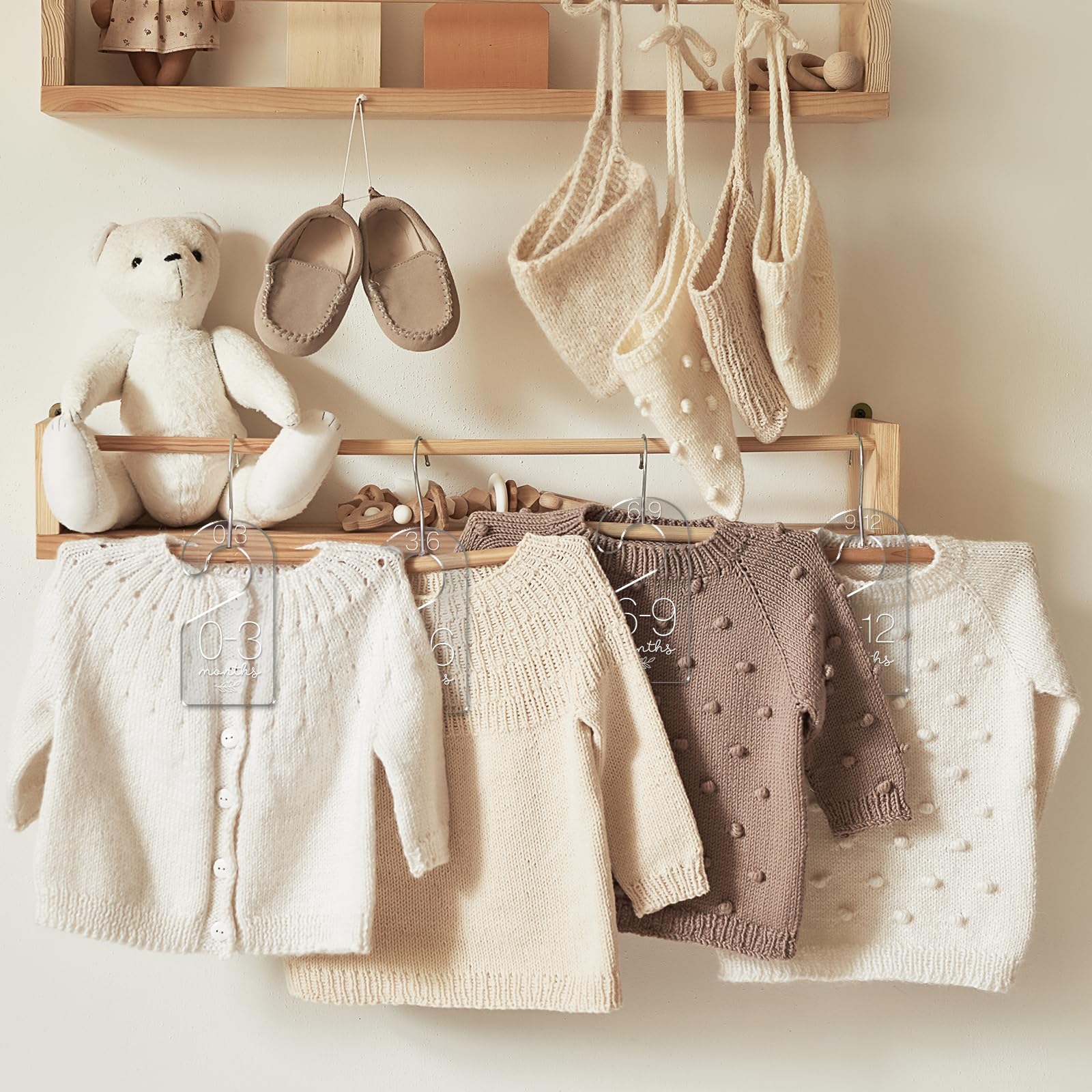 Whaline neutral nursery divider complements decor while tidying baby clothes
