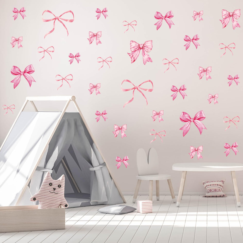 Whaline pink bow wall art for kids room supports storytelling spaces.