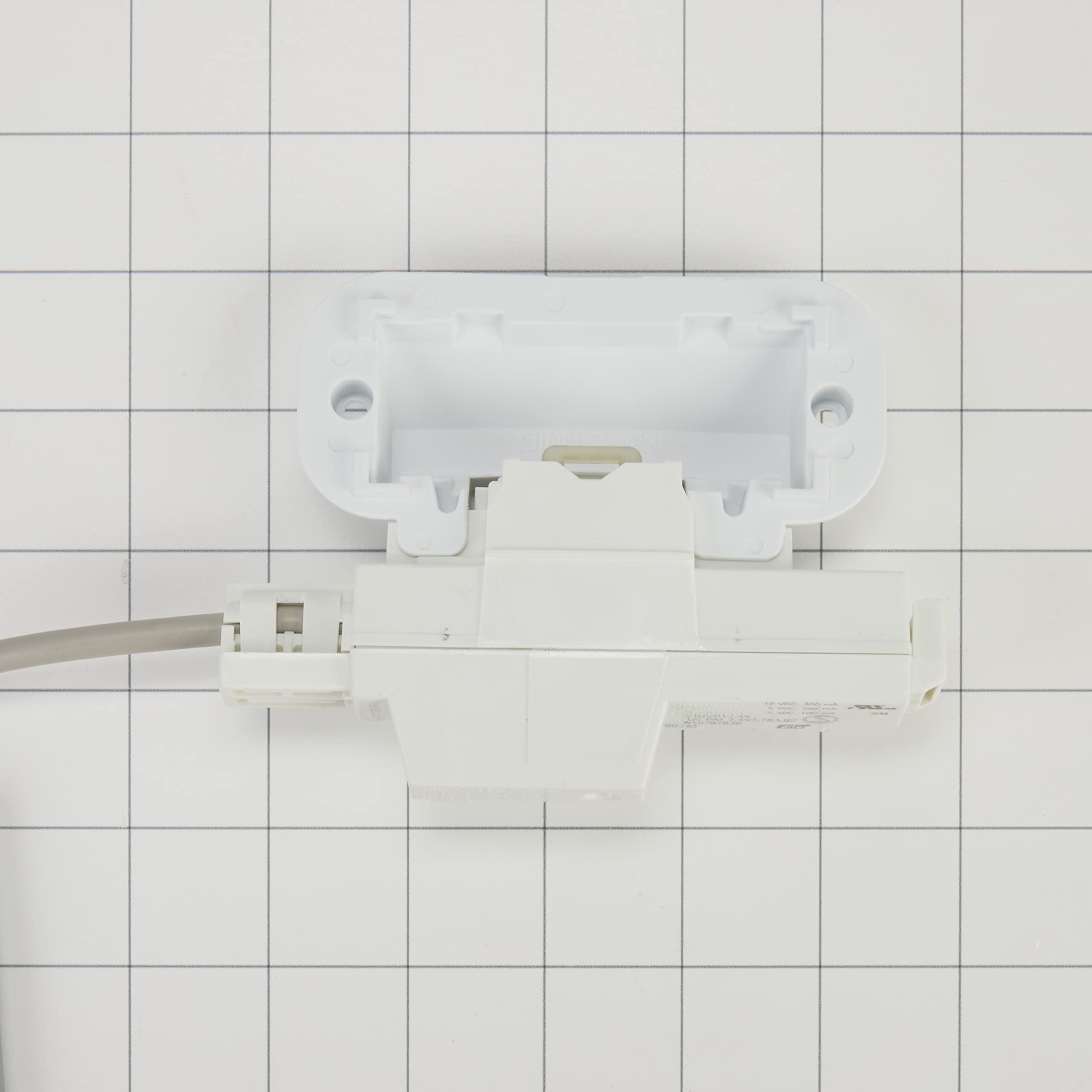 Whirlpool W10810403 lock installed in appliance ensures secure operation.