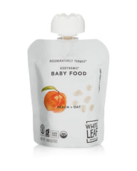 White Leaf Provisions peach oat puree pouch in hand for easy squeeze.