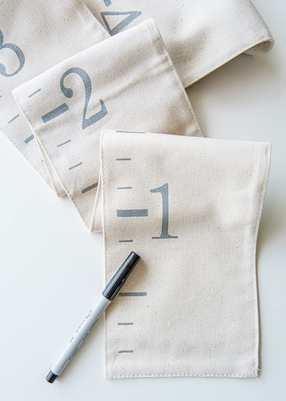 White Loft canvas growth chart closeup shows hand-lettered numbers for timeless decor and height tracking