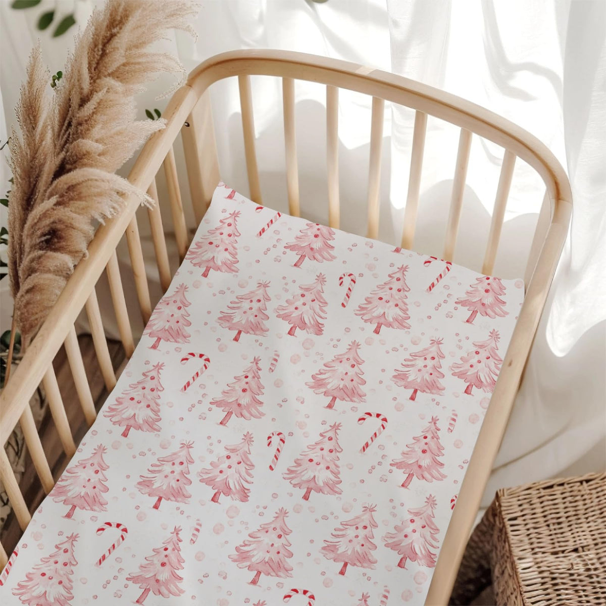 Wicbfdfv pink Christmas pine crib sheet folded for easy storage and quick setup
