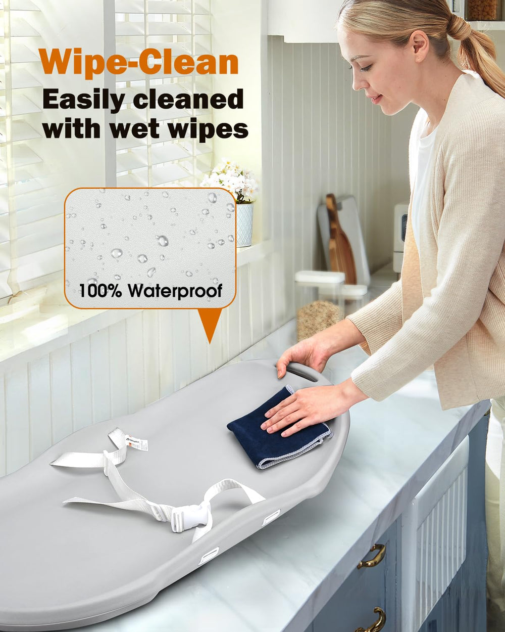Widitn pad features strap and non-slip base for secure diaper changes