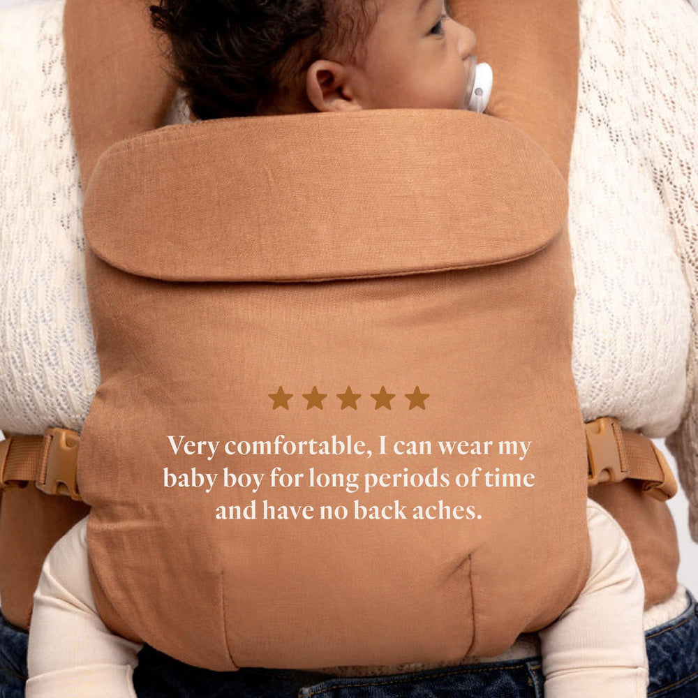 WildBird Aerial Buckle Carrier baby in front-facing-in position demonstrates intimate bonding.