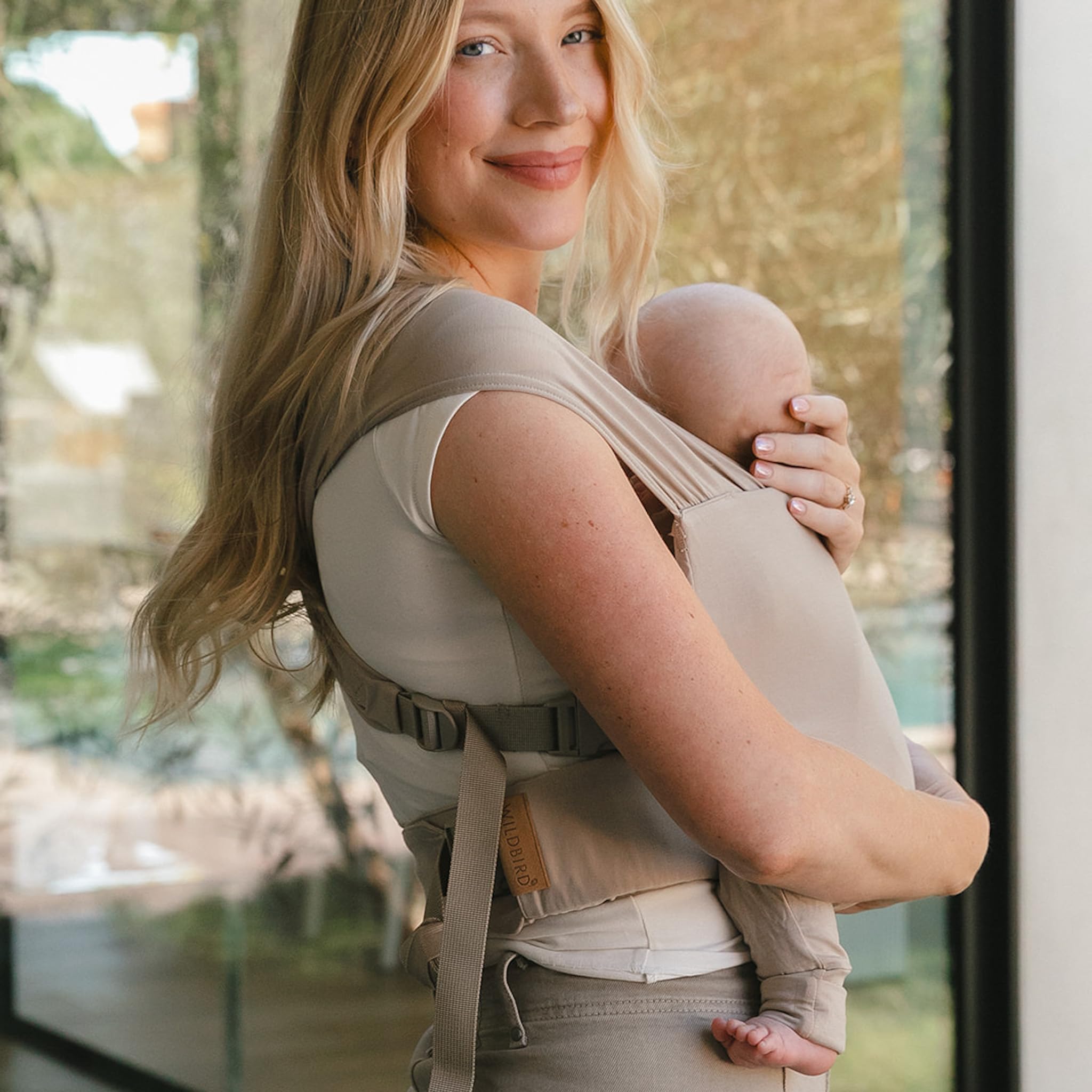 WildBird wrap demonstrates adjustable sizing for growing baby