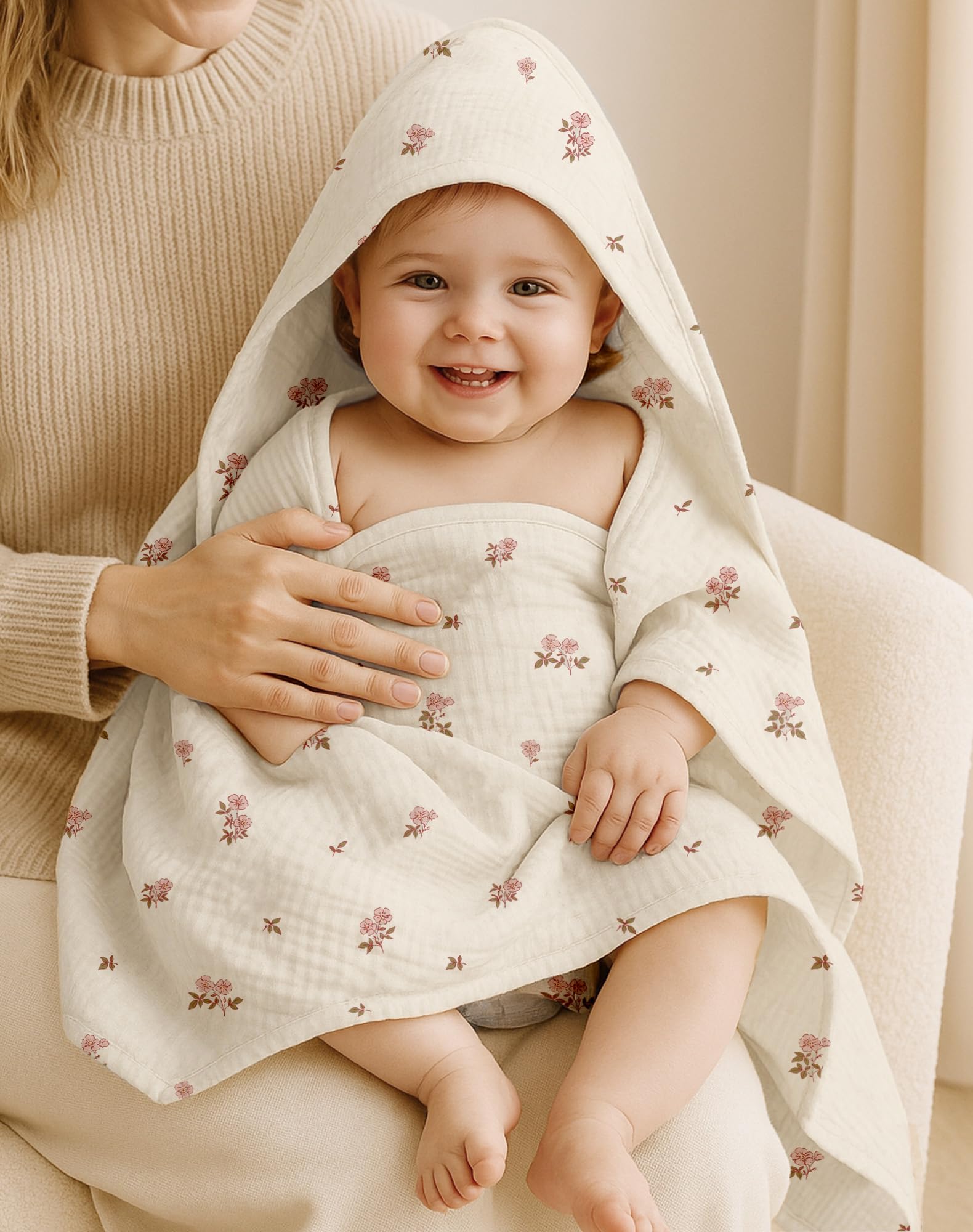 Wimist hooded baby towel Pink pattern highlights soft muslin cotton against baby skin.