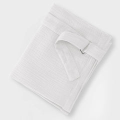 Wimist nursing cover large pocket holds bottle, tissues, and essentials.