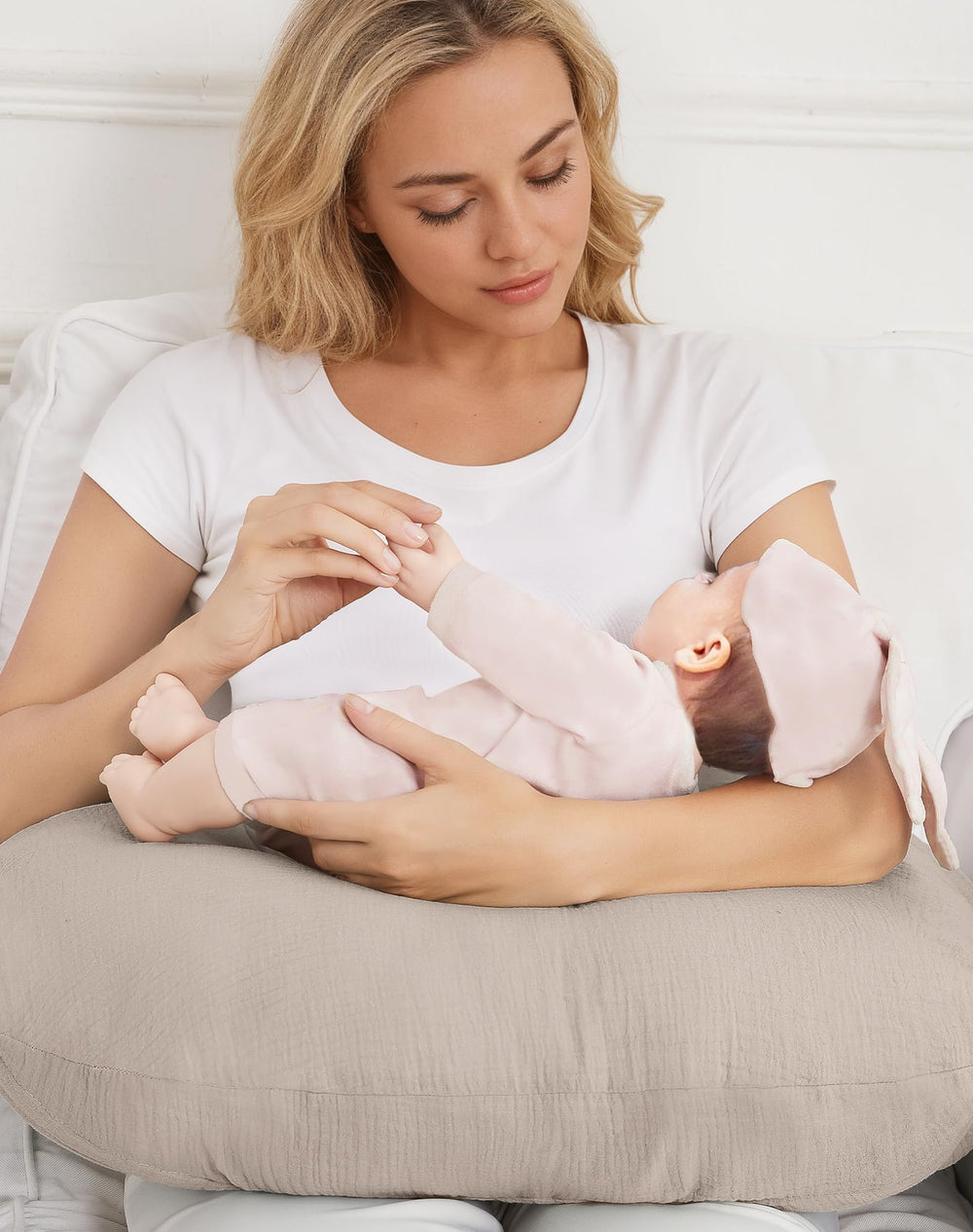 Wimist nursing pillow cover in dusty rose during a feeding session