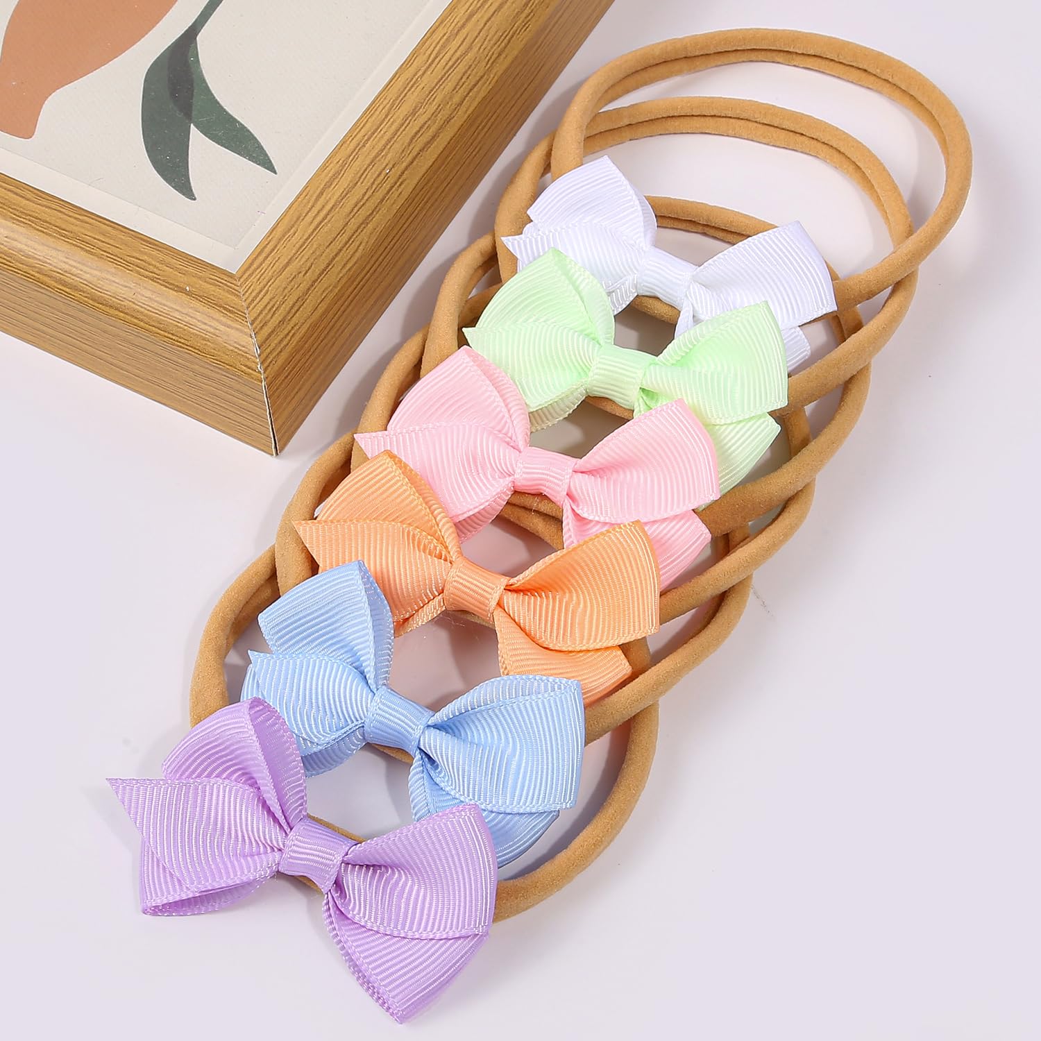 Headbands slip on easily for quick styling with WJYX BOWS.