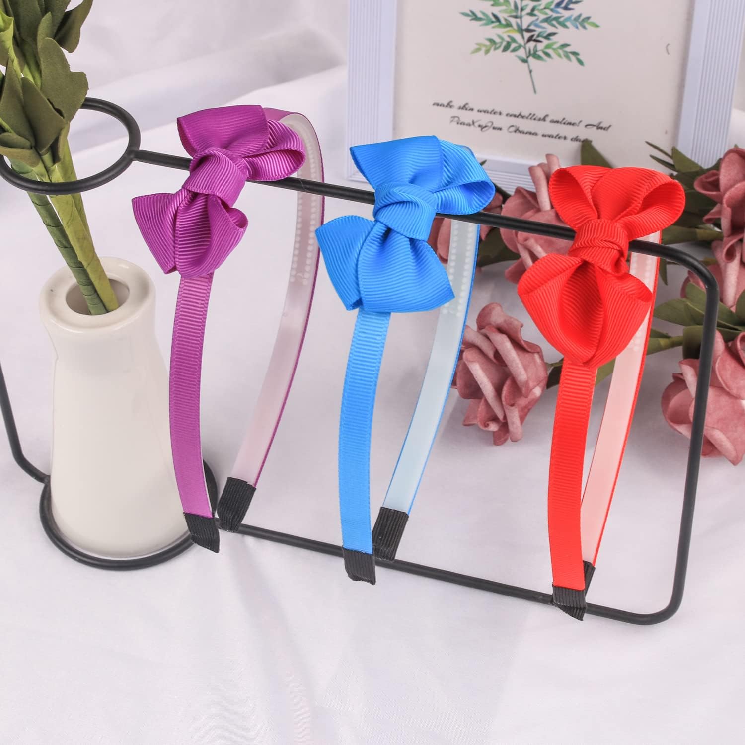 WJYX BOWS plastic headband with ribbon cover and teeth for comfortable wear.