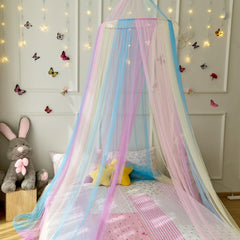 Wnqou Rainbow Bed Canopy in girls room creates a magical princess retreat for stories.