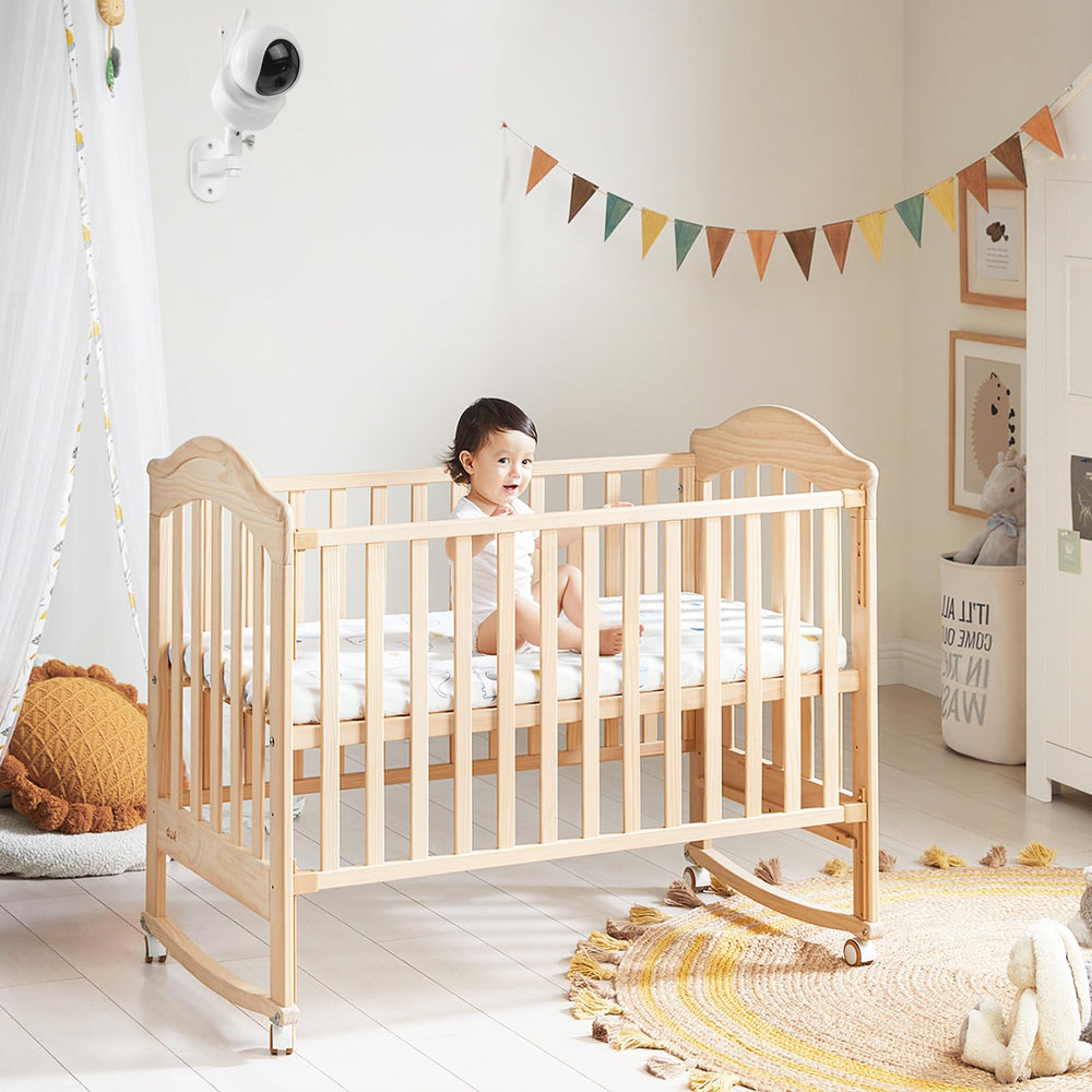 Wochel baby monitor mount positioned high on wall for safer, away-from-baby reach viewing.
