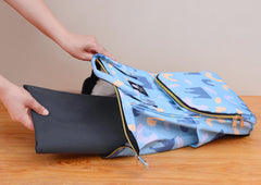 WOMUMON Splat Mat folded for travel is lightweight and portable