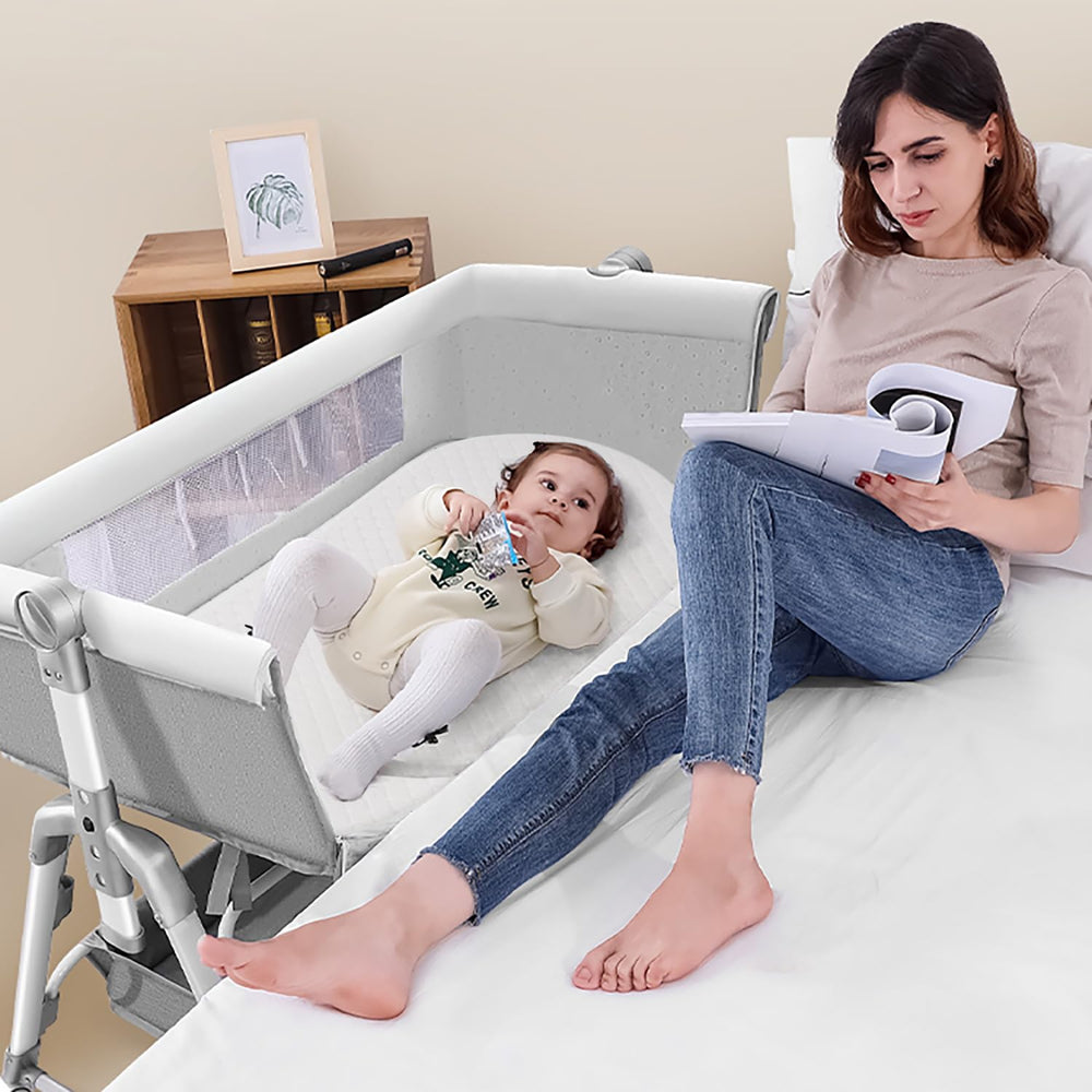 Wonder Living baby bassinet mattress unboxed showing compact, space-saving design.