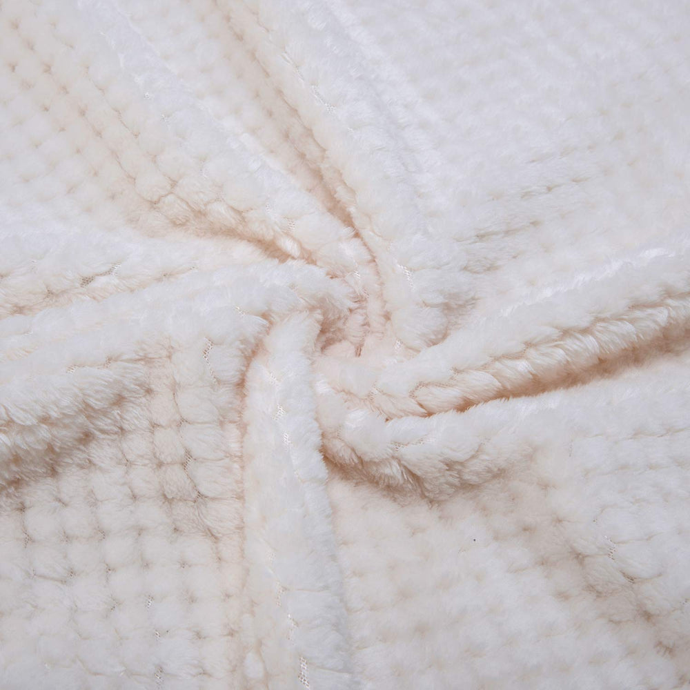 WONDER MIRACLE fuzzy throw blanket on bed and couch for versatile comfort