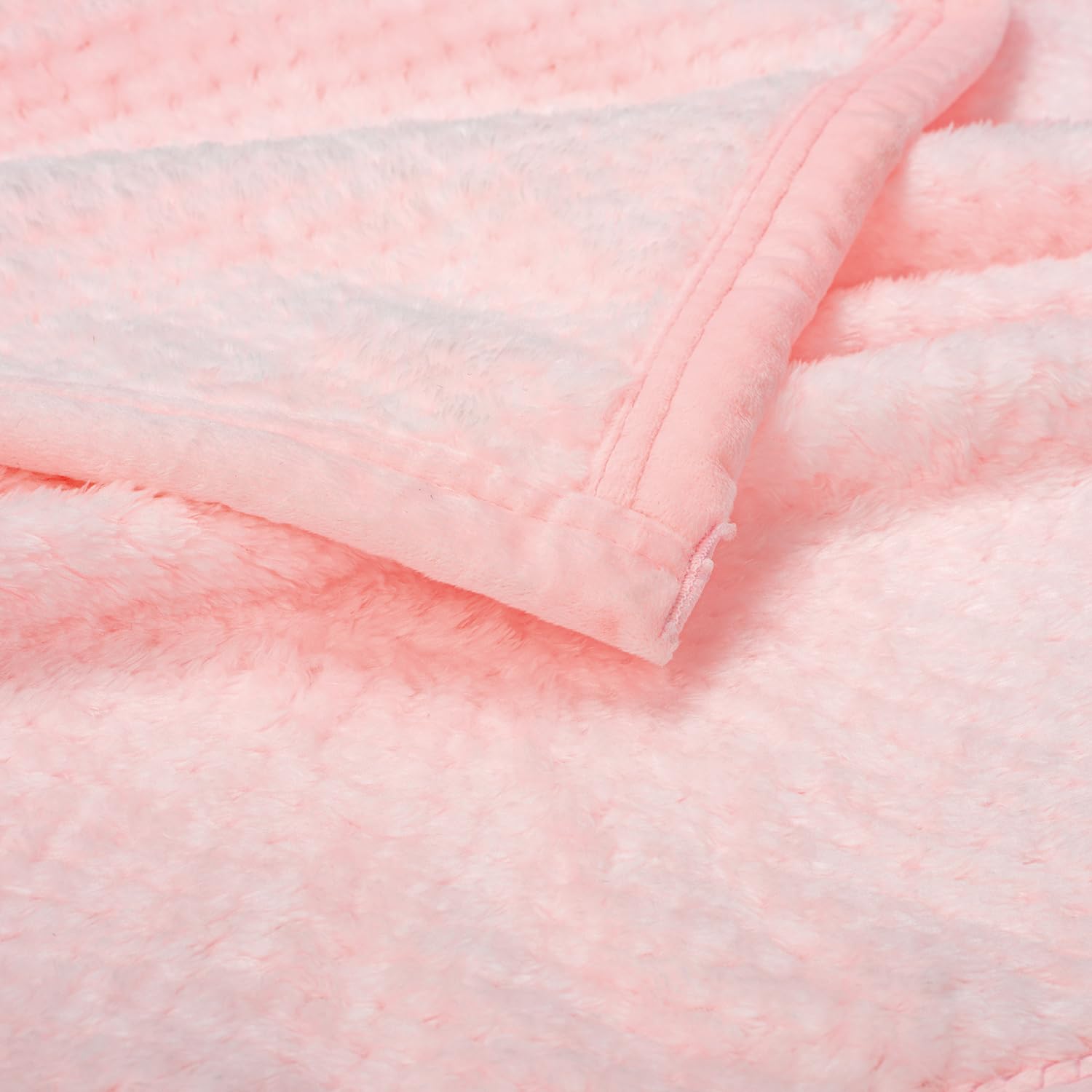 Wonder Miracle fuzzy blanket in pink and lavender pattern adds nursery charm.