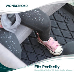WonderFold All Weather Mat W2 showing waterproof dirt protection on rough terrain.
