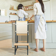 WOOD CITY Kitchen Stool Helper sturdy wooden frame shown by kitchen counter for learning independence.